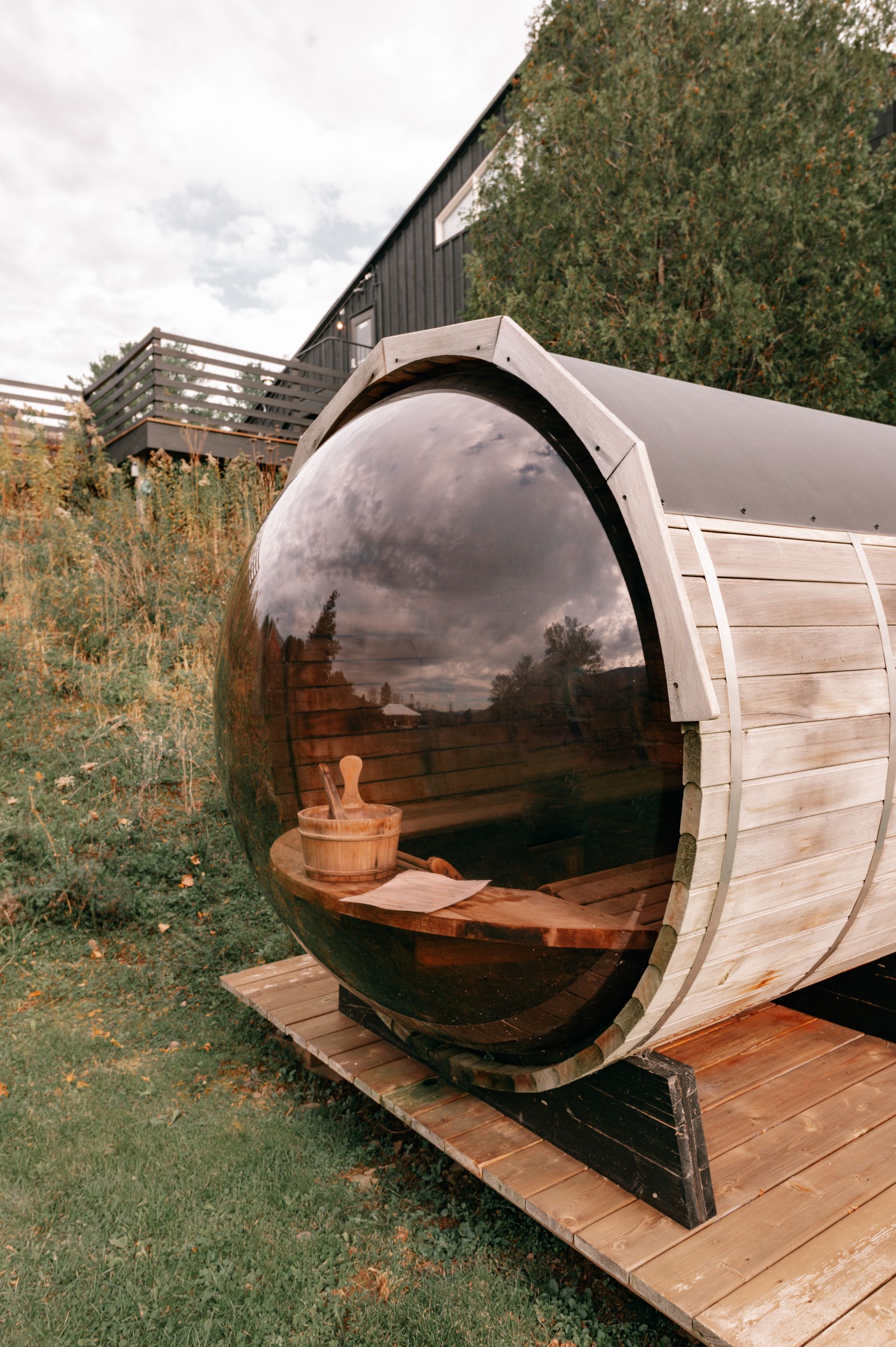 Pre-built outdoor barrel sauna in a backyard