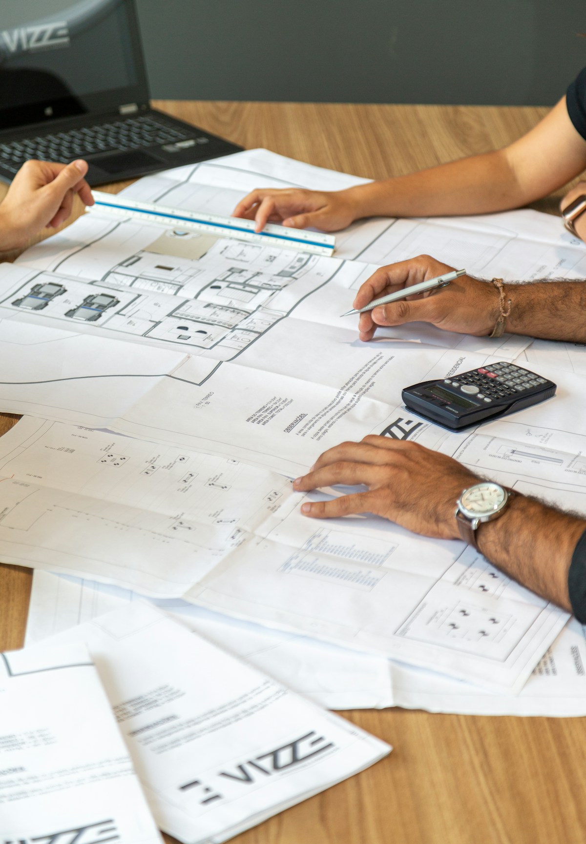 Architectural blueprints spread on a desk for planning review